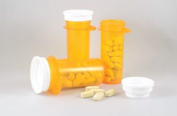 Three bottles of medication pills