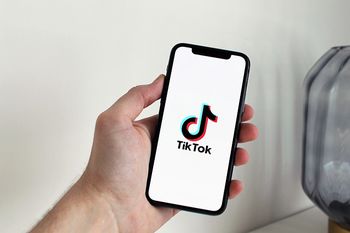 Opening Tiktok app on a smartphone