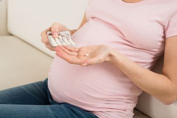 A pregnant woman is taking medication