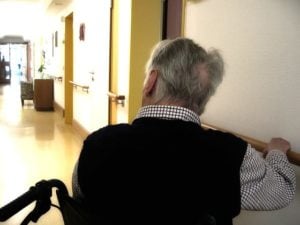 Backview of a senior sitting in a wheelchair