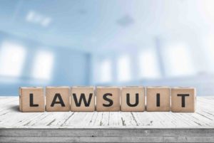 Lawsuit characters on blocks