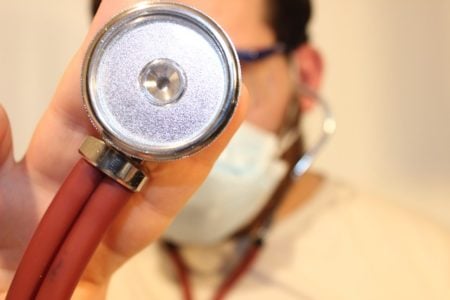 Closeup of a doctor holding a stethscope