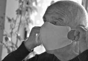 Senior is wearing a mask to avoid covid-19