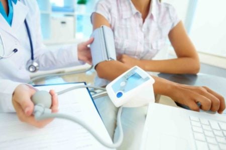 A doctor is diagnosing a patient