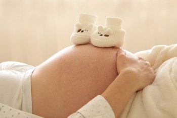 pregnant woman is expecting to have her baby