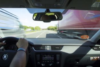 Inner view from a driver driving in the center of lane