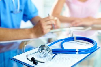 A doctor is diagnosing a patient
