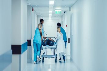ER doctors are pushing a sickbed in Emergency Room